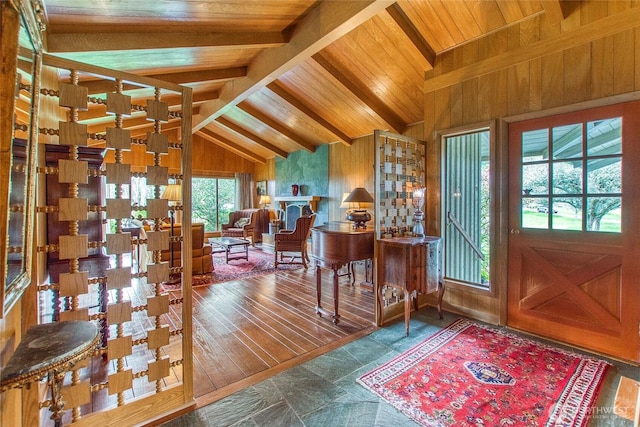 entrance foyer featuring wooden ceiling, lofted ceiling with beams, and wooden walls