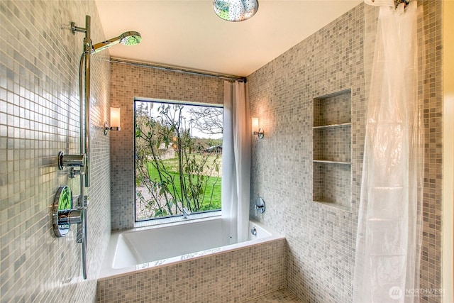 bathroom featuring tiled bath, tiled shower, and tile walls