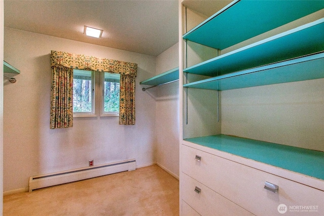 walk in closet featuring carpet flooring and baseboard heating