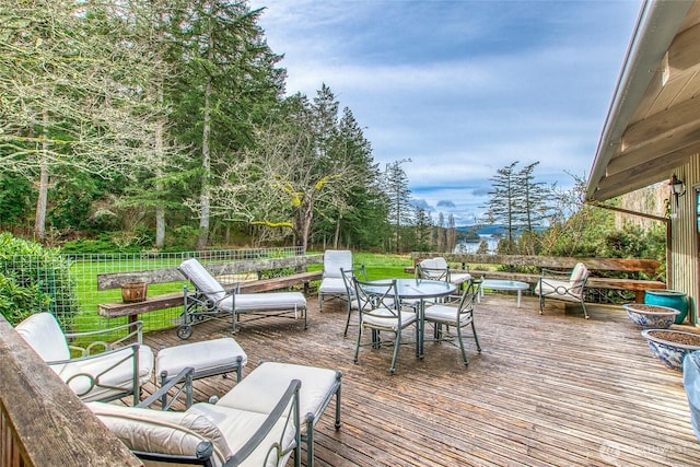 wooden terrace with fence and outdoor dining space