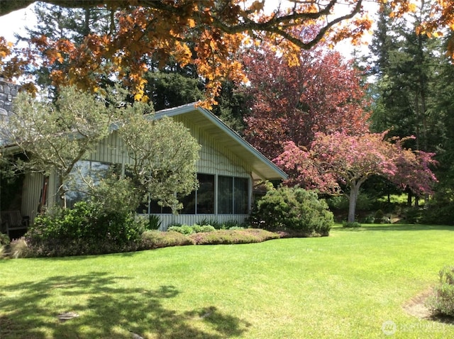 view of yard featuring a sunroom