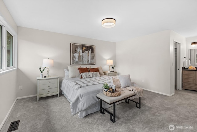 bedroom with baseboards, visible vents, and carpet flooring