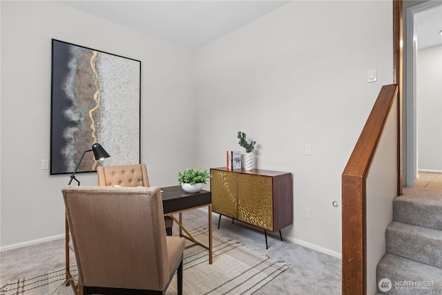 home office featuring light carpet and baseboards