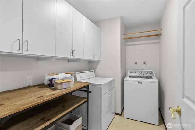 laundry area featuring cabinet space and independent washer and dryer