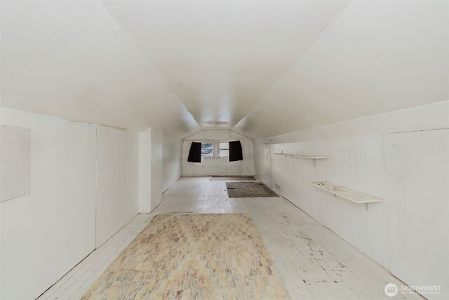 bonus room featuring lofted ceiling