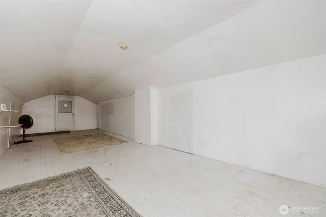 additional living space featuring vaulted ceiling