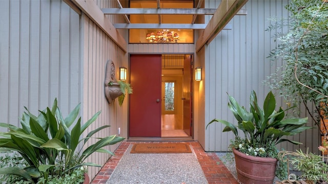 view of exterior entry with board and batten siding