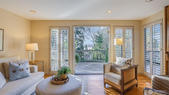 living room featuring wood finished floors and recessed lighting