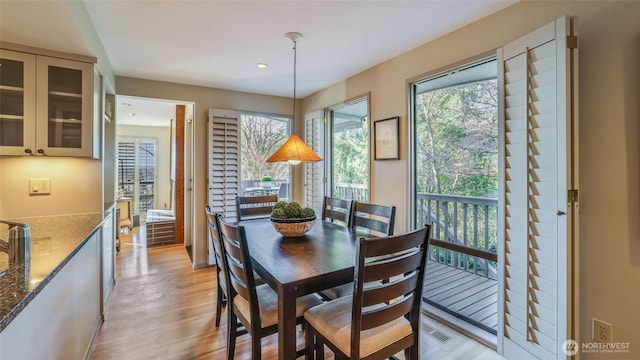 dining area featuring light wood-style floors and recessed lighting