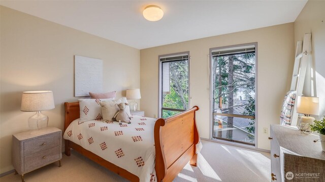 bedroom with light colored carpet