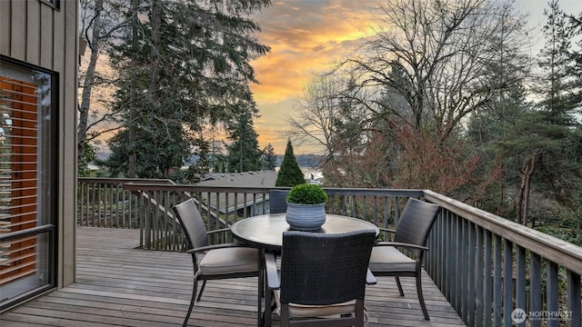 wooden terrace with outdoor dining space