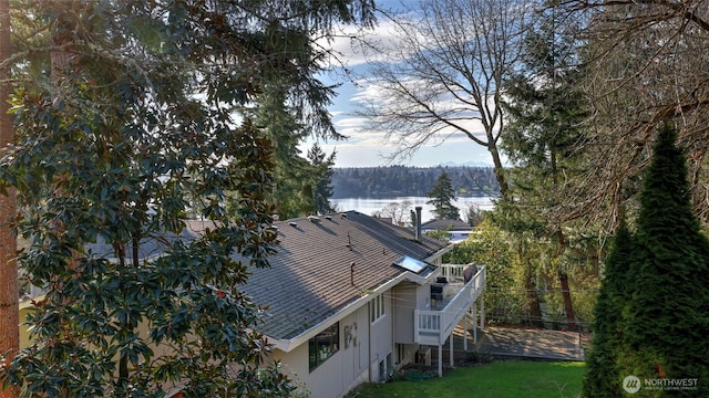 exterior space featuring a wooded view and stairs