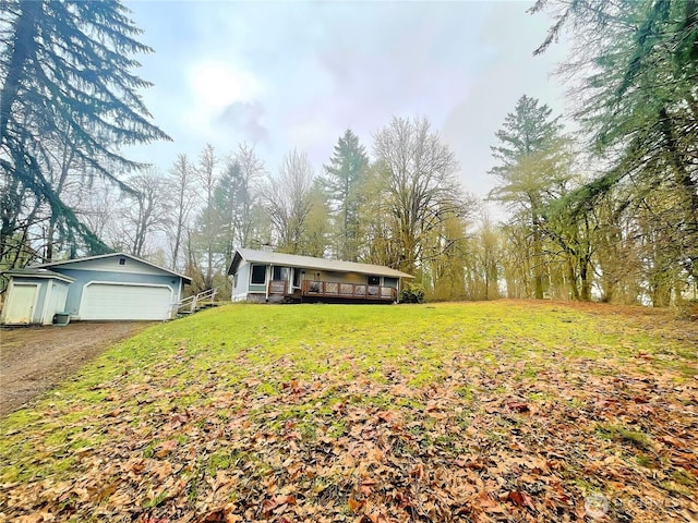 view of front facade with a garage and a front lawn