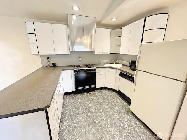 kitchen with white appliances, white cabinets, a sink, and ventilation hood