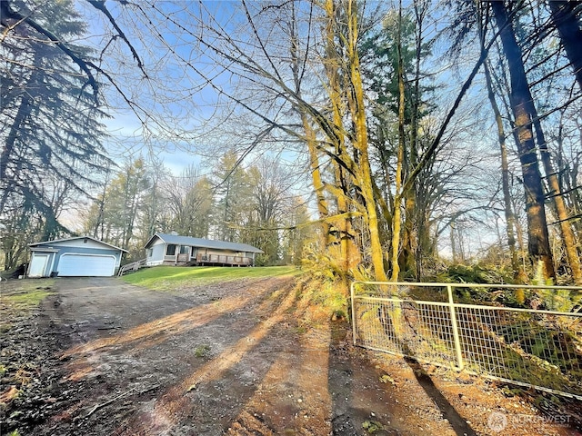 view of street featuring dirt driveway