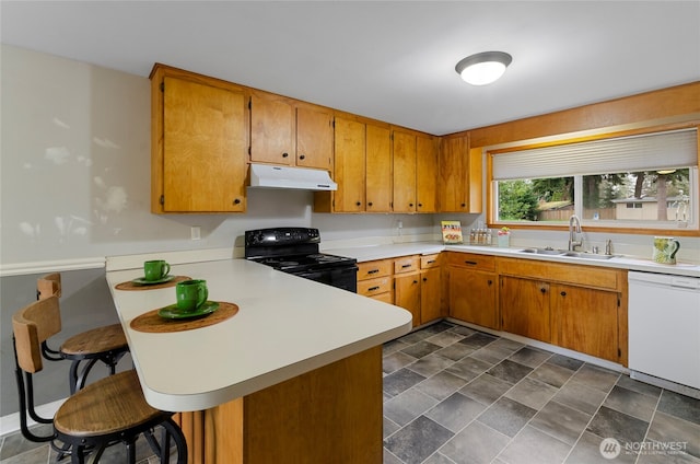 kitchen with white dishwasher, a sink, light countertops, under cabinet range hood, and black electric range oven