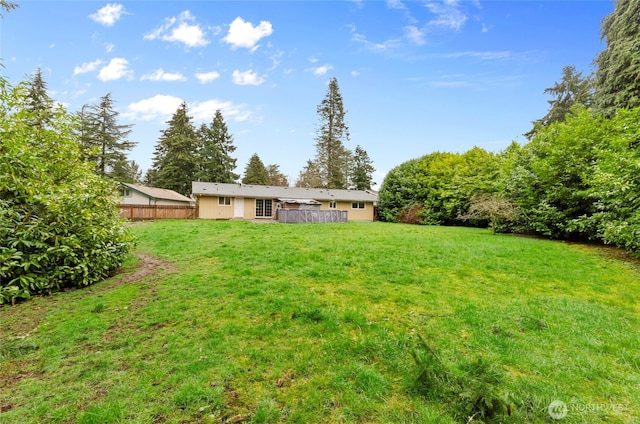 view of yard with fence