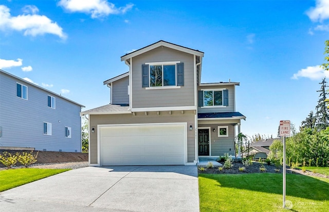 traditional-style home featuring an attached garage, a front yard, and driveway