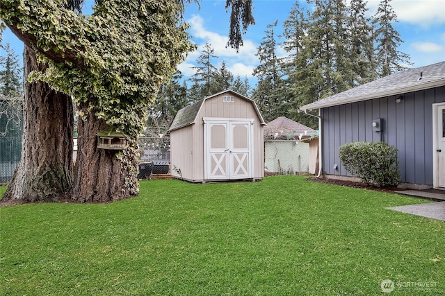 view of shed with fence