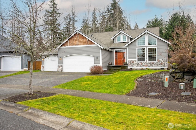 view of front facade featuring aphalt driveway, a shingled roof, a front yard, a garage, and stone siding