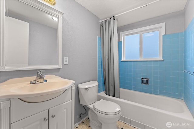 full bathroom with shower / bath combination with curtain, vanity, and toilet