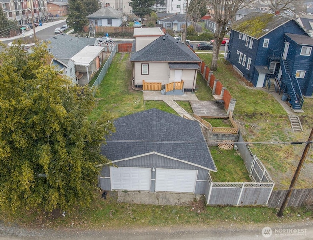 birds eye view of property with a residential view