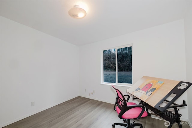 office with wood finished floors and baseboards