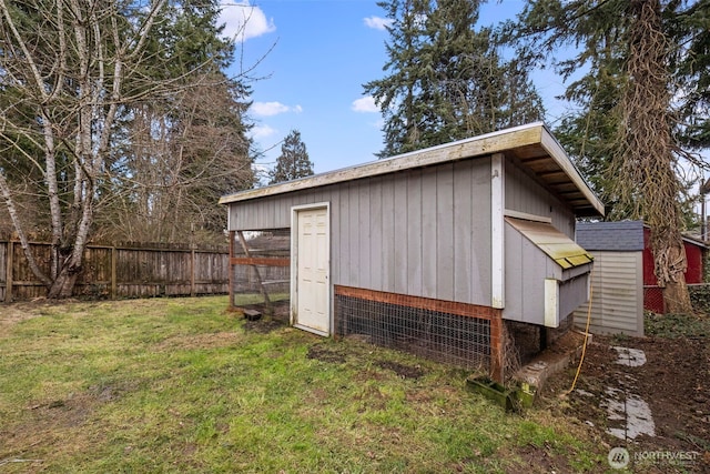 view of poultry coop with fence and a lawn