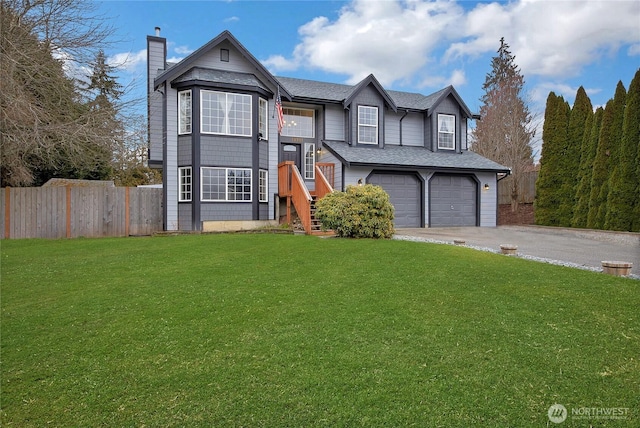 view of front facade with driveway, a front lawn, and an attached garage