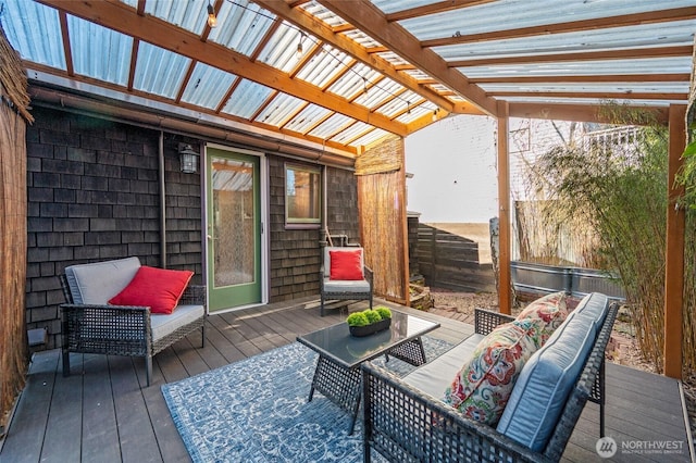 deck with fence, an outdoor hangout area, and a pergola