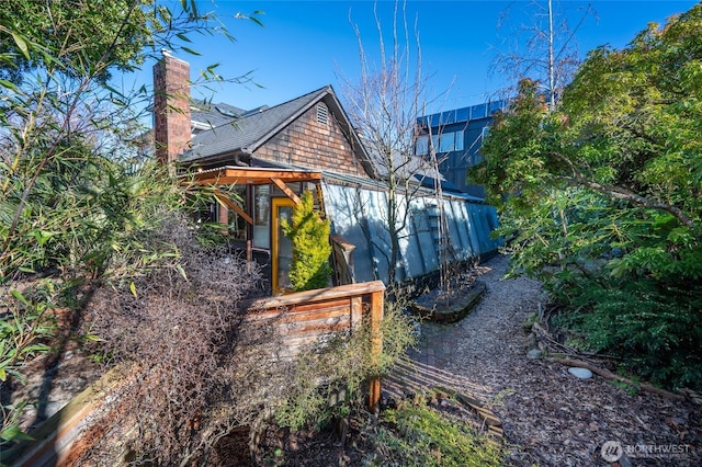 view of side of property with a chimney