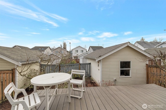 wooden terrace featuring a residential view