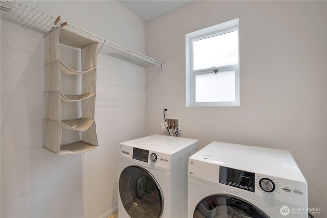 clothes washing area featuring laundry area and independent washer and dryer