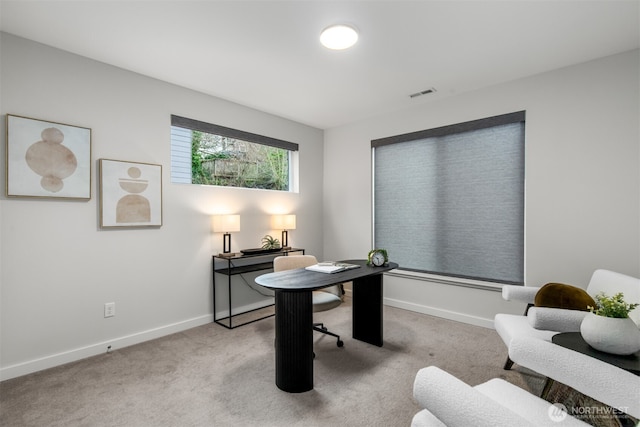 office with light colored carpet, visible vents, and baseboards