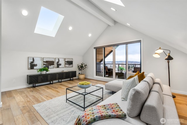 living area with vaulted ceiling with skylight, recessed lighting, baseboards, and wood finished floors