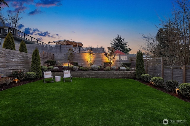 view of yard with a fenced backyard