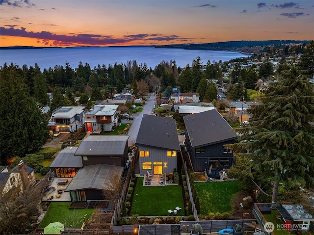 bird's eye view with a residential view and a water view