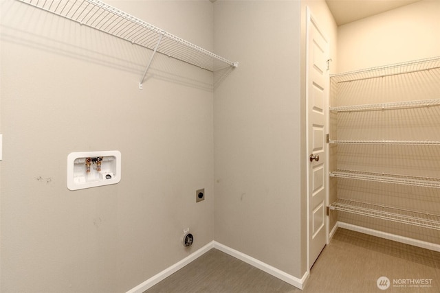 clothes washing area featuring laundry area, hookup for a washing machine, electric dryer hookup, and baseboards