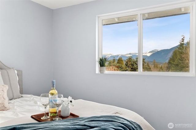 bedroom featuring a mountain view