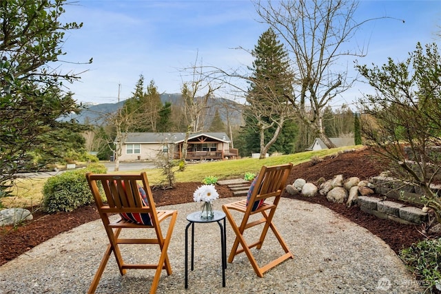 view of patio / terrace featuring a mountain view