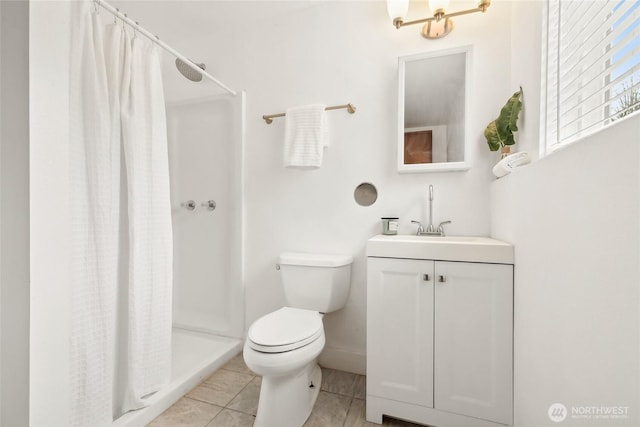 full bath with toilet, a stall shower, tile patterned floors, and vanity