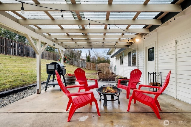 view of patio with an outdoor fire pit, a fenced backyard, and a pergola