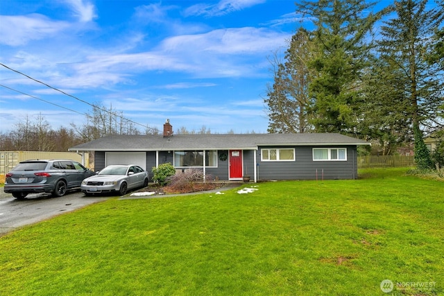 single story home with aphalt driveway, a garage, fence, a chimney, and a front yard