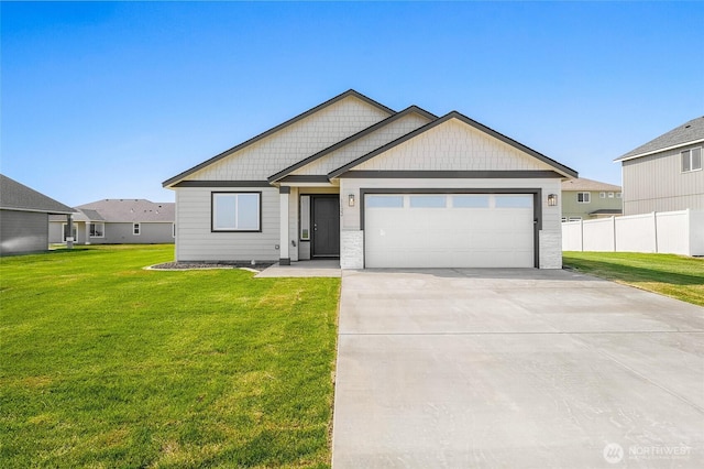 single story home with fence, an attached garage, concrete driveway, and a front yard