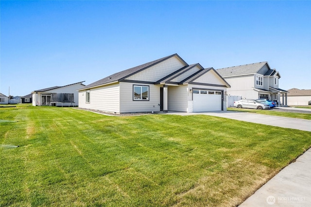 view of front of home with a garage, a front lawn, and concrete driveway