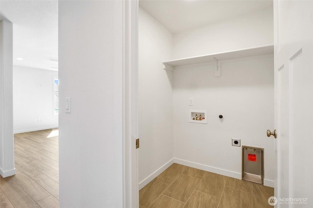 laundry area featuring electric dryer hookup, baseboards, laundry area, and hookup for a washing machine
