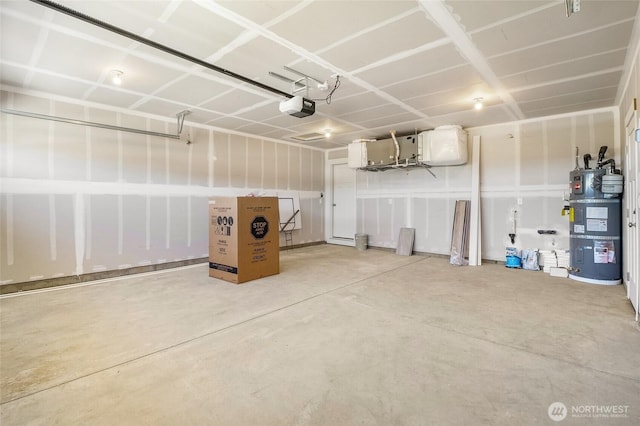 garage with strapped water heater and a garage door opener