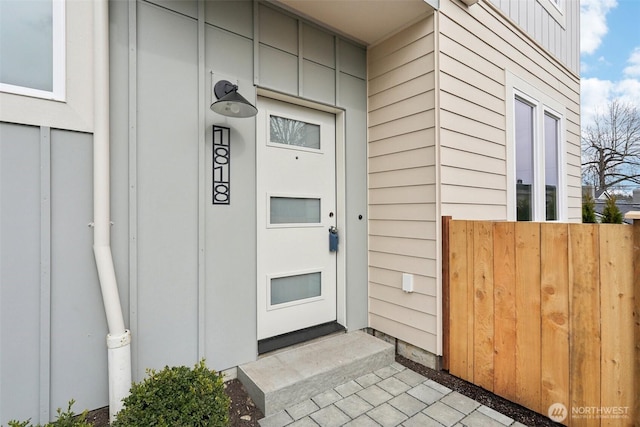 view of exterior entry with board and batten siding