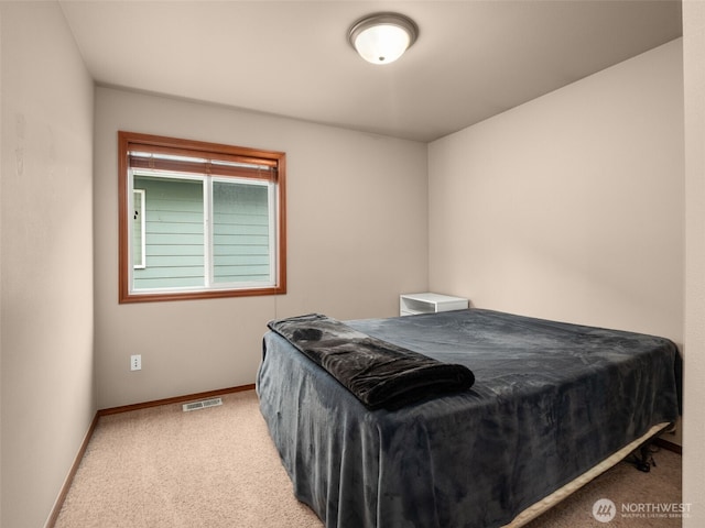 bedroom featuring carpet, visible vents, and baseboards