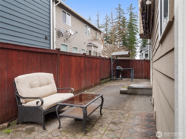 view of patio featuring fence